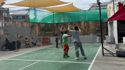 Playing basketball.